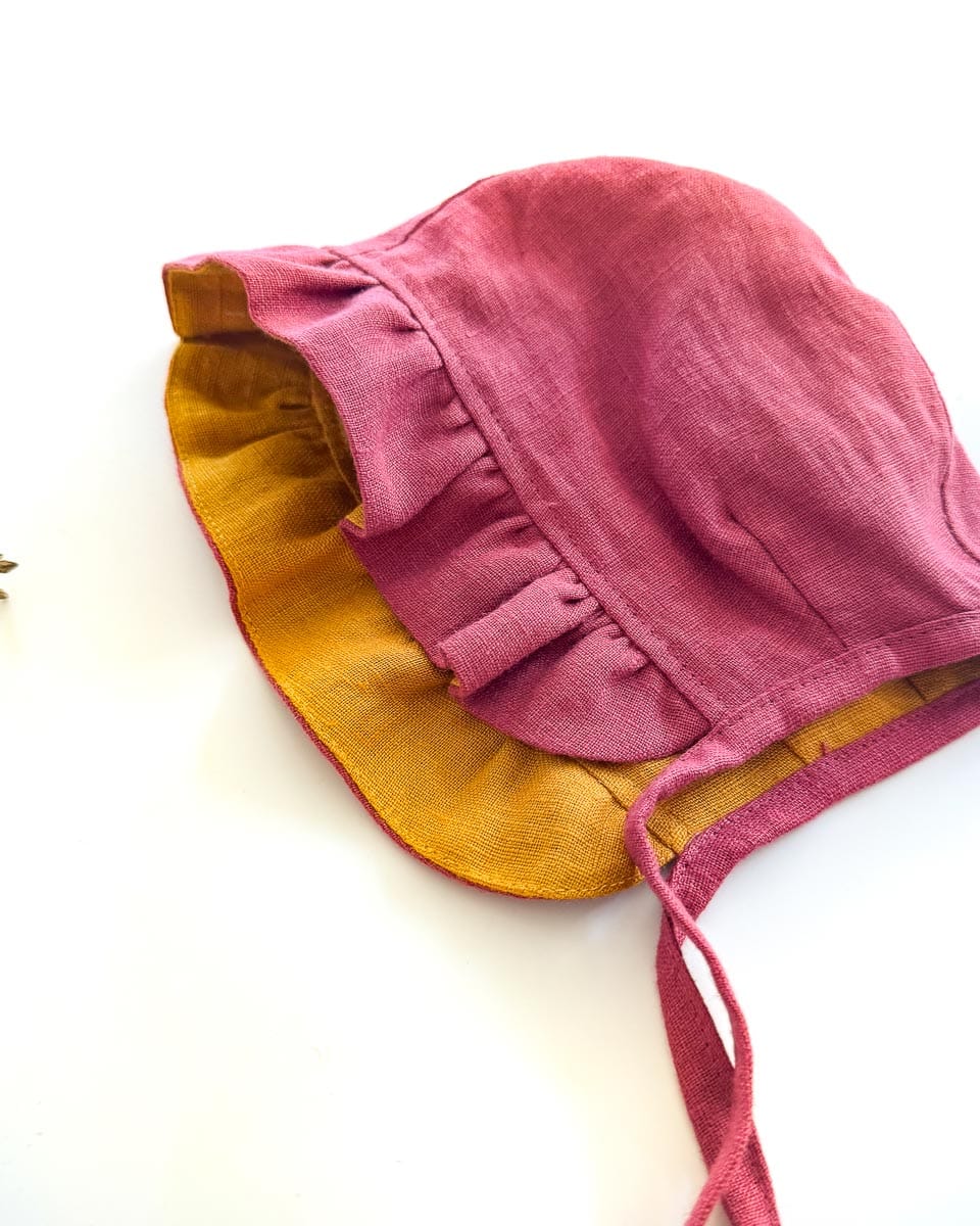 Sofortkauf: Leinen Baby Bonnet in Himbeere/Senf, Gr. 44-46