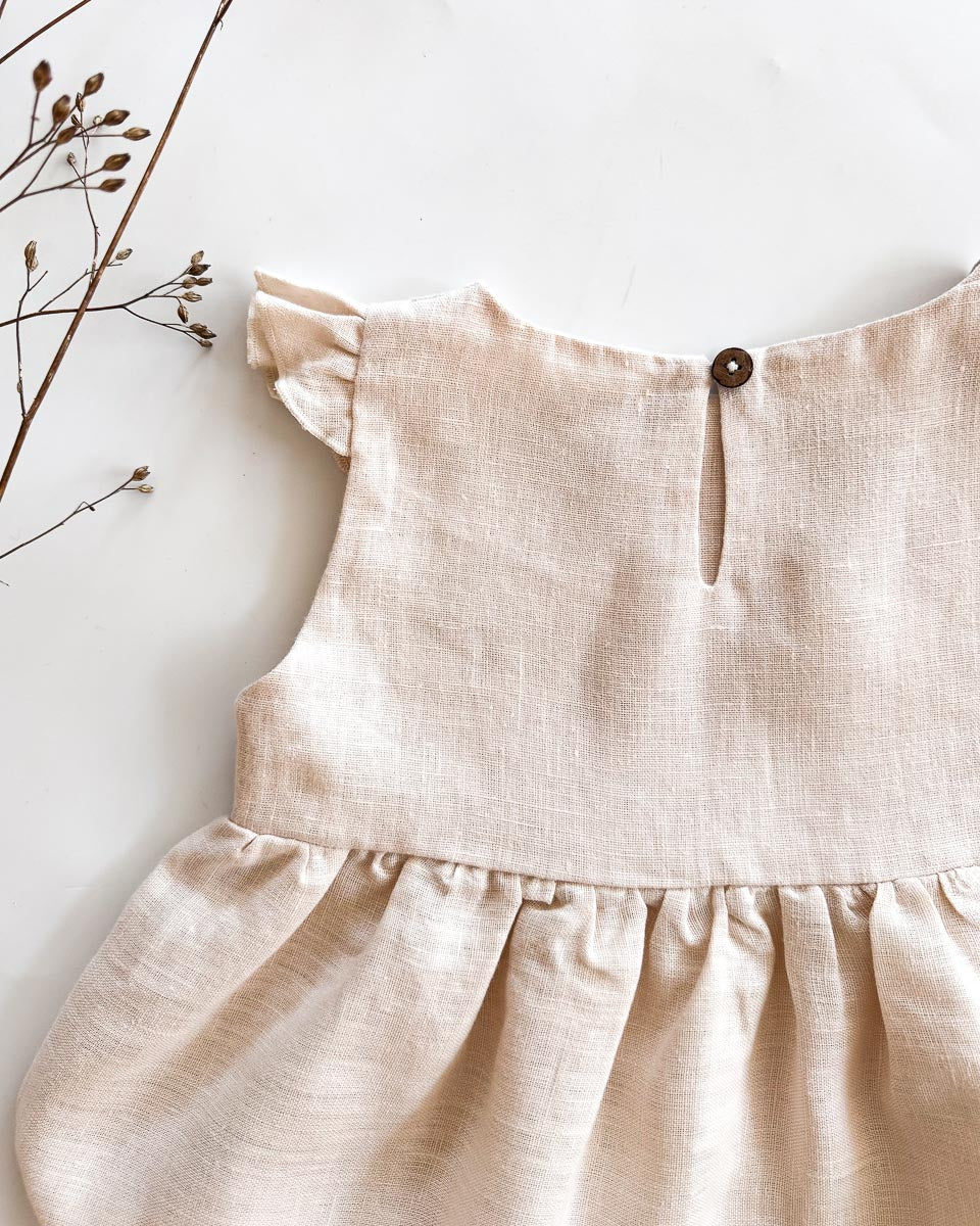 Sofortkauf: Leinenkleid mit Flügelärmeln in Wollweiß, Gr. 86/92