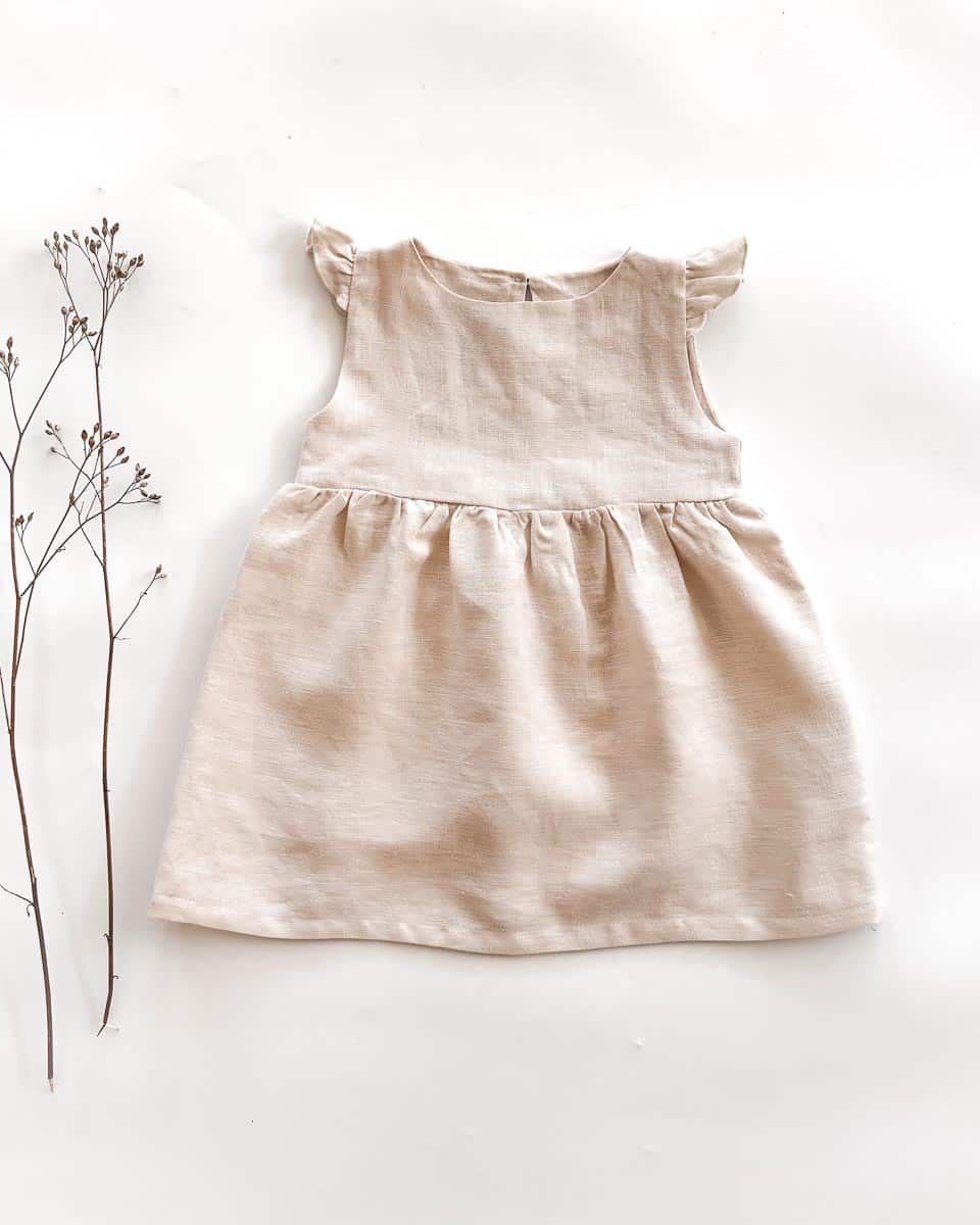 Sofortkauf: Leinenkleid mit Flügelärmeln in Wollweiß, Gr. 86/92