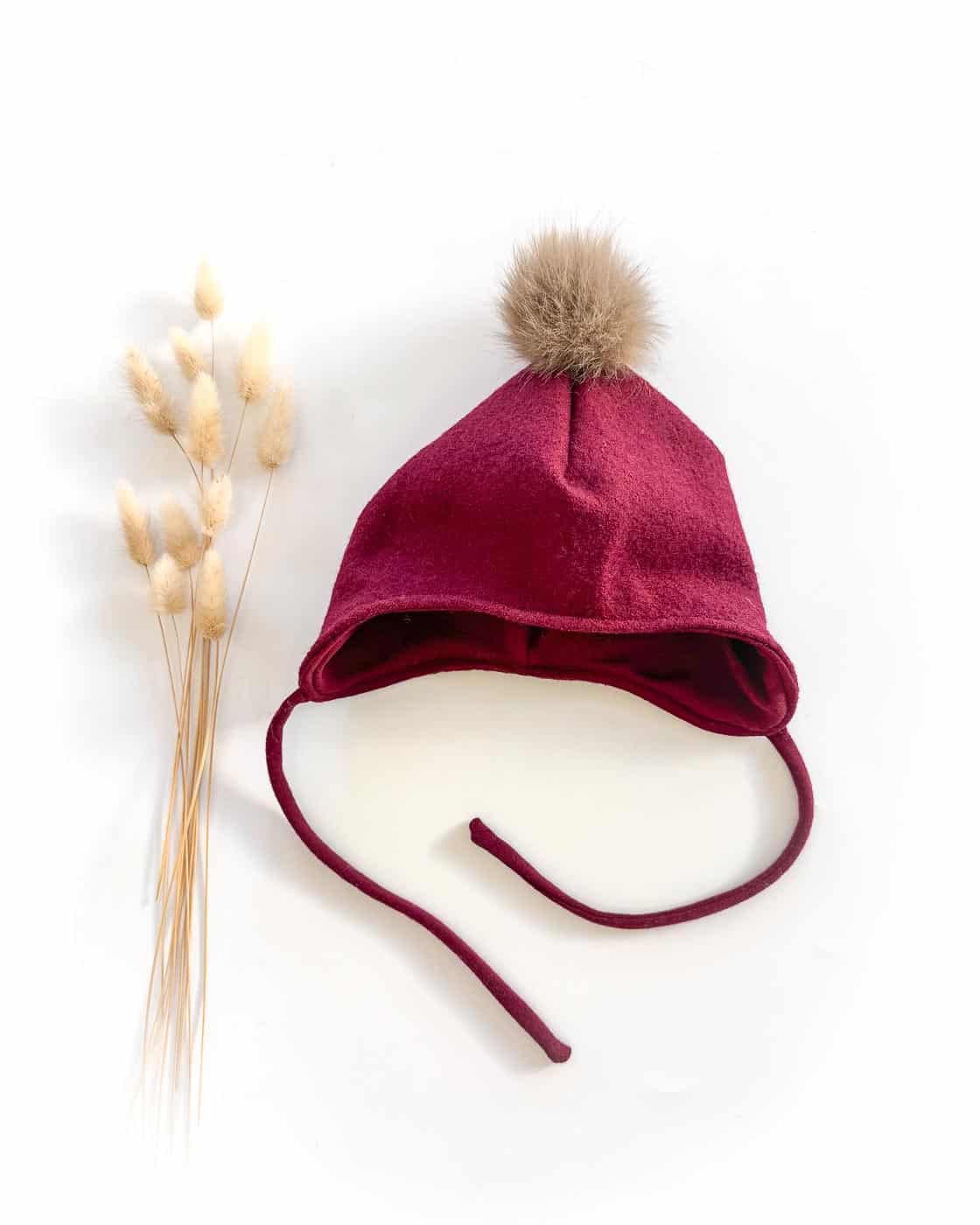 Sofortkauf: Wollwalk Bommelmütze in Beere mit Wolljersey gefüttert, Gr. 52-54